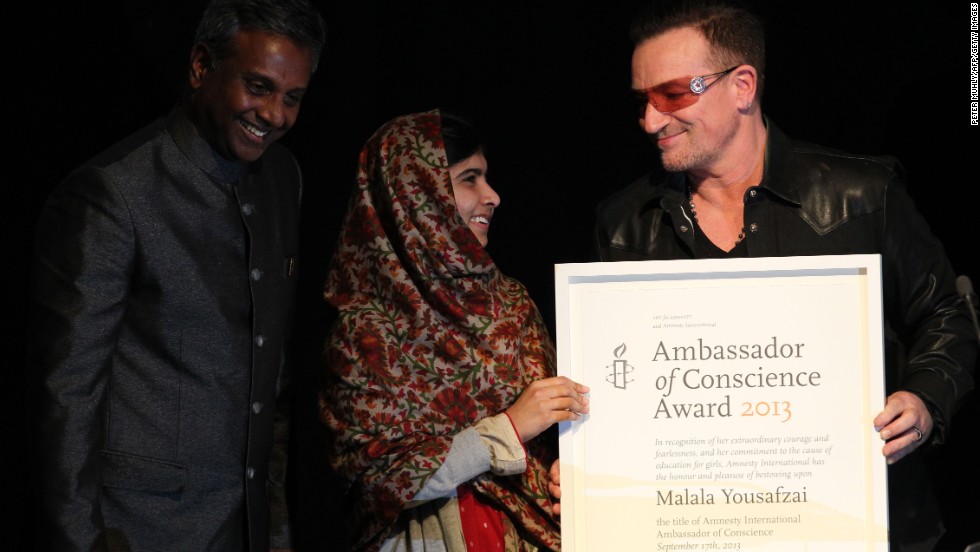 Musician Bono, right, and Salil Shetty, the secretary general of Amnesty International, honor Malala with the Amnesty International Ambassador of Conscience Award at the Manison House in Dublin, Ireland, in September 2013. The award is Amnesty International&#39;s highest honor, recognizing individuals who have promoted and enhanced the cause of human rights.