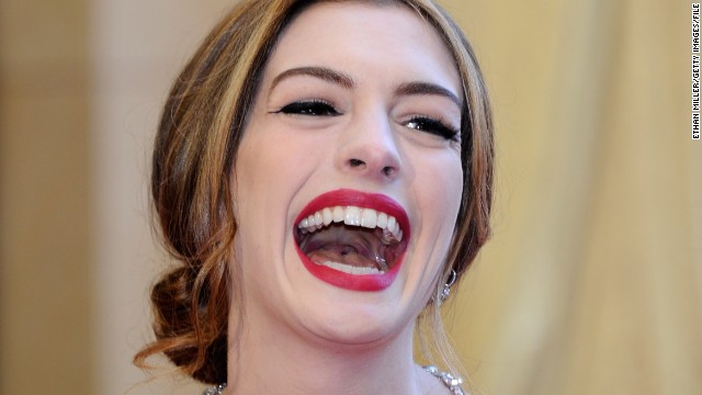 HOLLYWOOD, CA - FEBRUARY 27: Actress Anne Hathaway laughs as she arrives at the 83rd Annual Academy Awards at the Kodak Theatre February 27, 2011 in Hollywood, California. (Photo by Ethan Miller/Getty Images) 