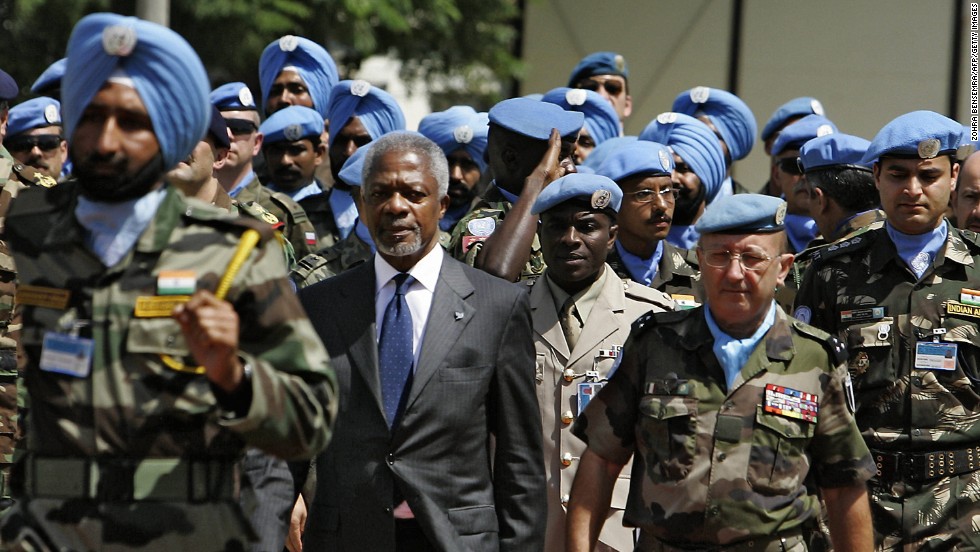 Former United Nations Secretary General Koffi Annan, center, with French Forces commander Gen. Alain Pellegrini, right, review UNIFIL soldiers upon Annan&#39;s arrival to the U.N. peacekeeping base in the southern Lebanese town of Naqura, on August 29, 2006. Annan and the United Nations won the Nobel Peace Prize in 2001. 