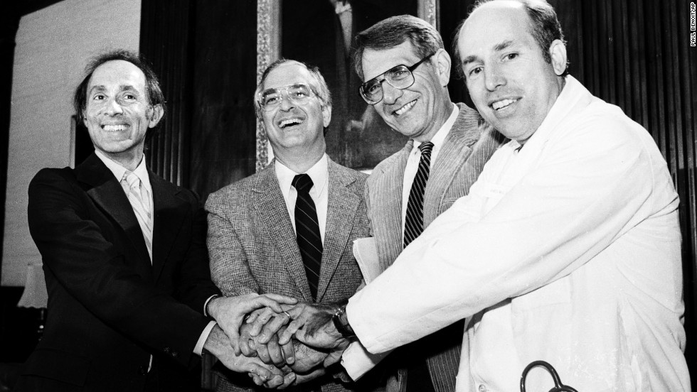 Members of the International Physicians for the Prevention of Nuclear War clasp hands on October 11, 1985, at the group&#39;s Boston headquarters after the organization was awarded the 1985 Nobel Peace Prize. The doctors are, from left, Eric Chivian, co-founder; John Pastore, secretary; Sidney Alexander, president of the U.S. affiliate group; and James Muller, co founder. 