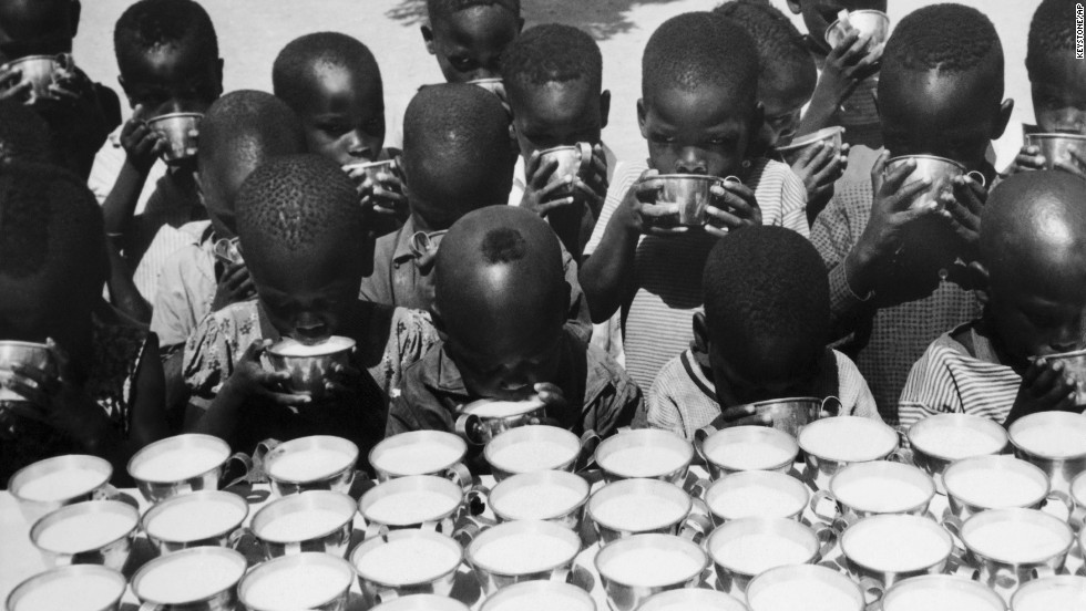 Children drink milk handed out by UNICEF workers in Moundou, Chad, on October 26, 1965. UNICEF won the Nobel Peace Prize in 1965. 