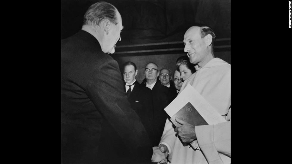 Georges Pire, right, receives the Nobel Peace Prize in 1958 for his efforts to help European refugees leave their camps and return to a life of freedom and dignity. 