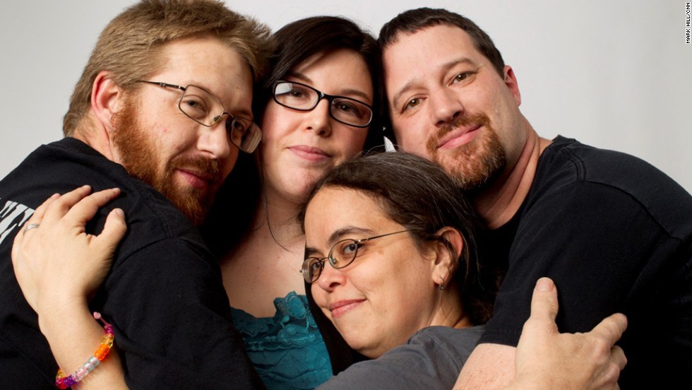 To some, polyamory means more than an open relationship -- it&#39;s about having multiple committed relationships. Billy Holder, left, and wife Melissa Holder, second from right, live with their partner Jeremy Mullins, right. Pictured with them is Amy Munowitz, a friend who also identifies as &quot;poly.&quot;