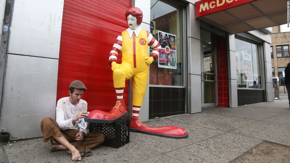 One of Banksy's pieces is this fiberglass sculpture of Ronald McDonald having his shoes shined in front of a Bronx McDonald's.