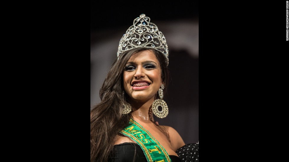 Raika Ferraz smiles after winning the Miss T Brasil 2013