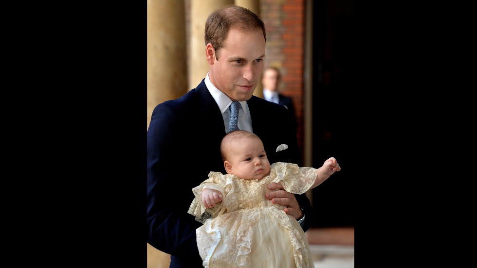 Prince William holds Prince George ahead of the christening.