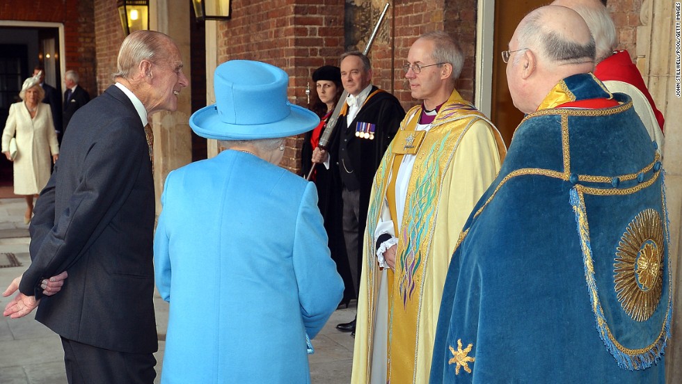 Queen Elizabeth II and Prince Philip talk to the Archbishop of Canterbury, Justin Welby as they arrive for the the christening.