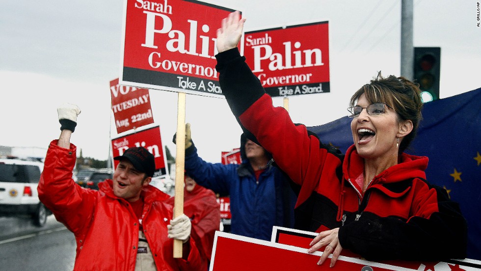 Palin stands in the rain in Anchorage in August 2006 as she campaigns for the Republican gubernatorial nomination. Palin defeated incumbent Frank Murkowski and former state legislator John Binkley.