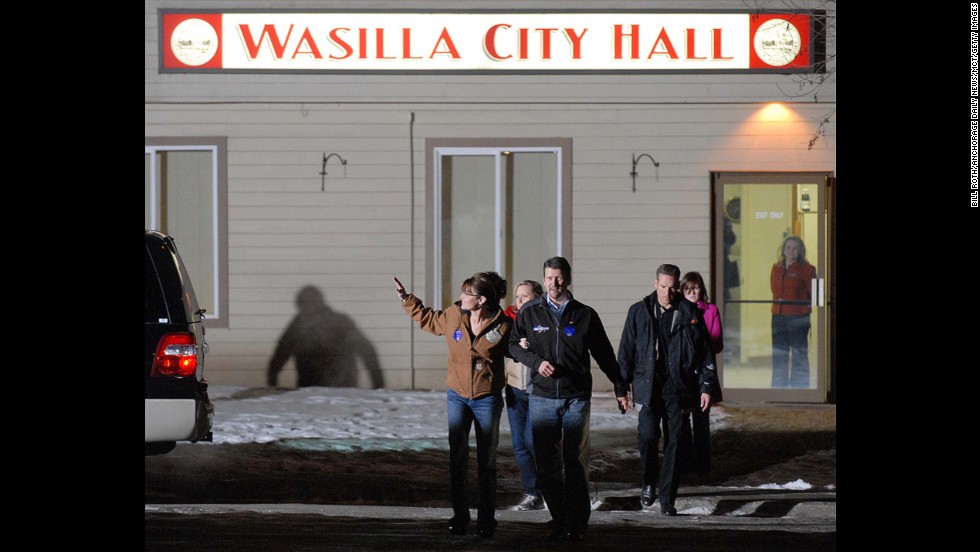 Palin and her husband leave City Hall after she voted in her hometown of Wasilla, Alaska, in November 2008. The Palins then flew to Arizona to join McCain.