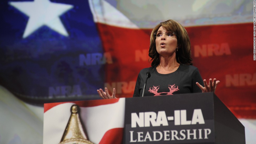 Wearing a shirt that reads &quot;Women hunt,&quot; Palin blasts Obama and gun control advocates for &quot;exploiting&quot; recent mass shootings as she speaks to the National Rifle Association convention in Houston in May 2013.