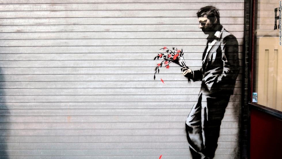 A Banksy piece covers the main entrance to Larry Flynt&#39;s Hustler Club in New York&#39;s Hell&#39;s Kitchen in October 2013.