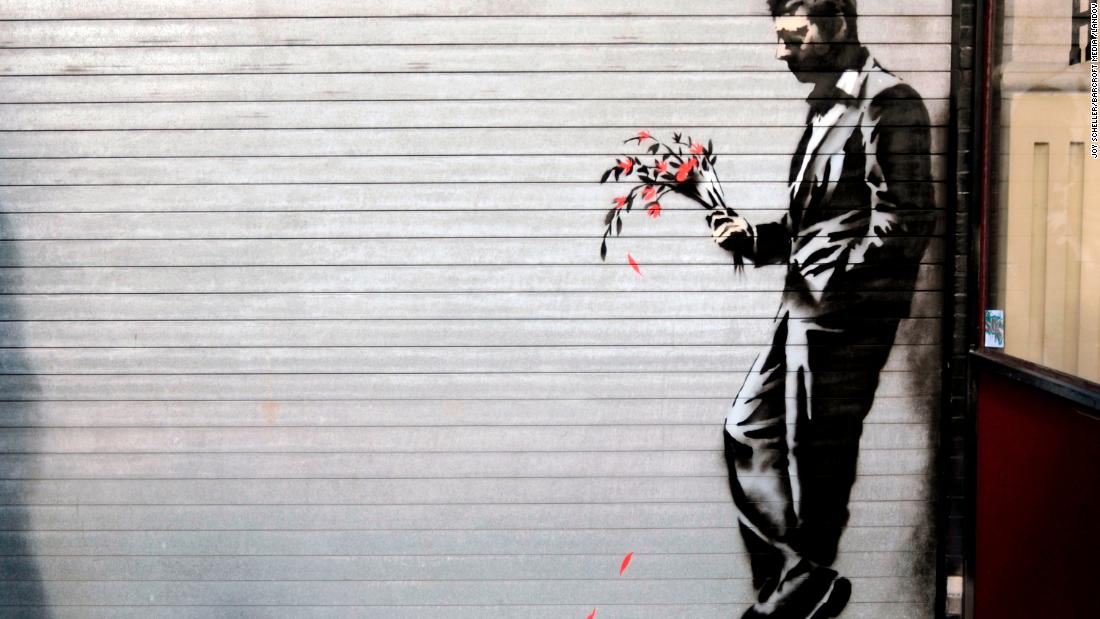A Banksy piece covers the main entrance to Larry Flynt's Hustler Club in New York's Hell's Kitchen in October 2013.