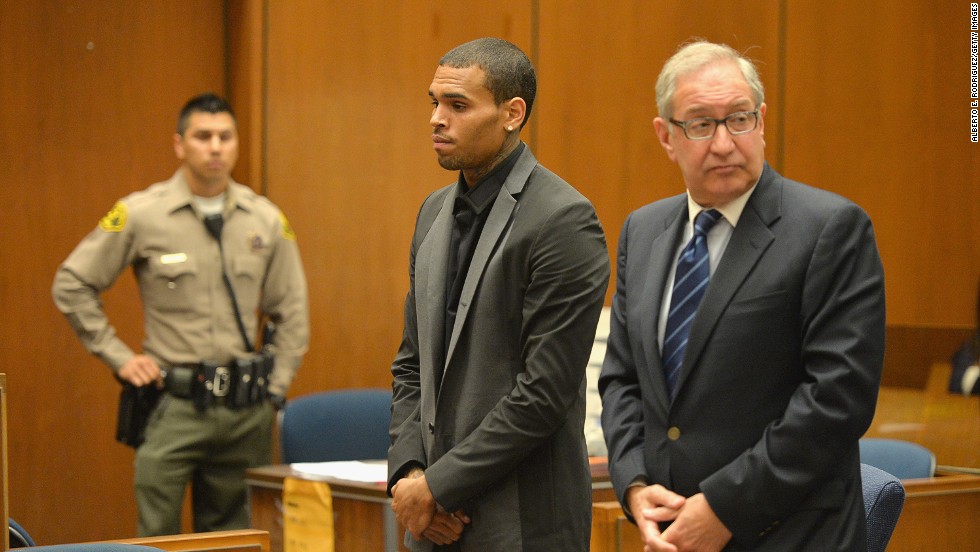 &lt;strong&gt;July 2013:&lt;/strong&gt; &lt;a href=&quot;http://www.cnn.com/2013/08/15/showbiz/chris-brown-court/index.html&quot;&gt;Brown&#39;s probation was revoked July 15&lt;/a&gt; after he was accused of hit-and-run driving and driving without a license. A woman told investigators Brown &quot;went ballistic&quot; after a traffic accident and screamed at her. The charges were dropped after Brown reached a &quot;civil compromise&quot; with his accuser a month later. Here, he appears in court with his attorney, Mark Geragos.