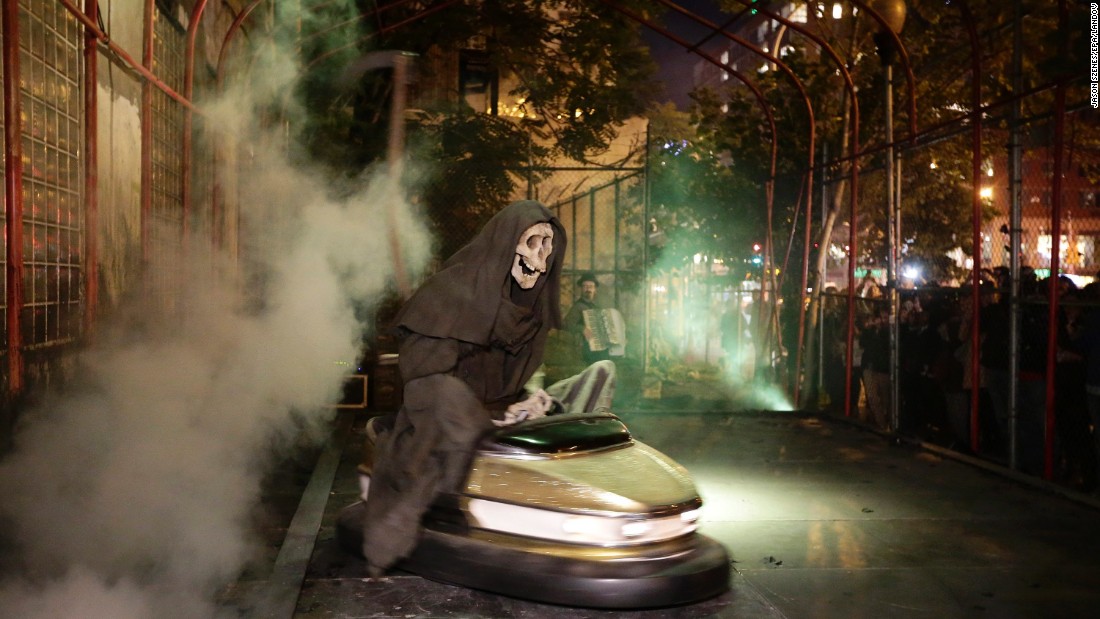 Banksy's art exhibit &quot;Grim Reaper Bumper Car&quot; sits on New York's Lower East Side in October 2013. The famously anonymous artist, whose paintings regularly go for six figures at auction houses around the world, said he was on a &quot;residency on the streets of New York.&quot;