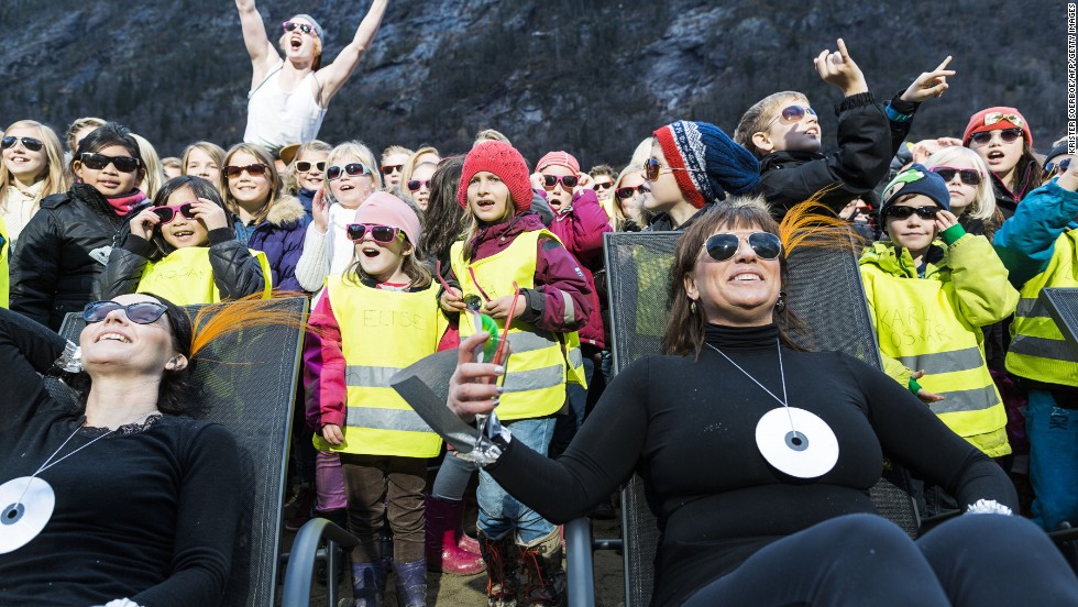 Residents and visitors lap up the sun in the market square of Rjukan in Norway. Up until this week the town -- which sits in a village -- was devoid of winter sun. That changed because...