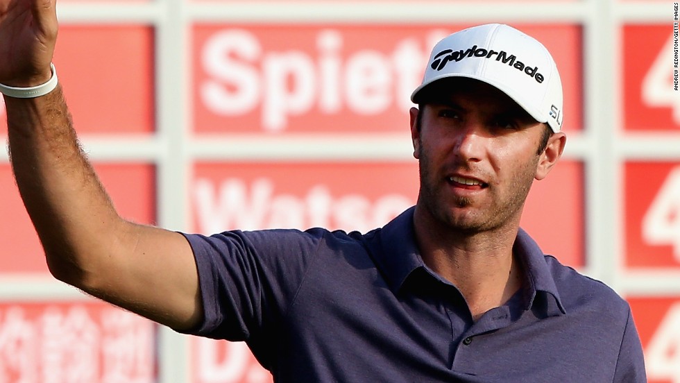 Dustin Johnson acknowledges the gallery after completing his record equaling nine-under 63 in Shanghai.  