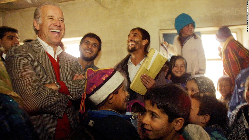 Biden, as chairman of the Senate Foreign Relations Committee, laughs with students as he visits a high school in Kabul, Afghanistan, in 2002.