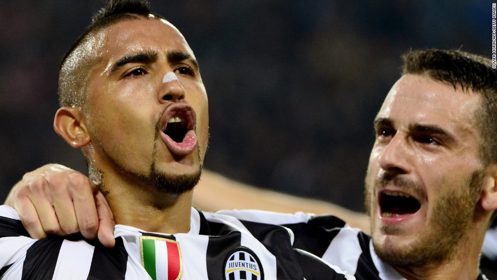 Arturo Vidal is congratulated by Leonardo Bonucci after putting Juventus ahead from the spot against Real Madrid.