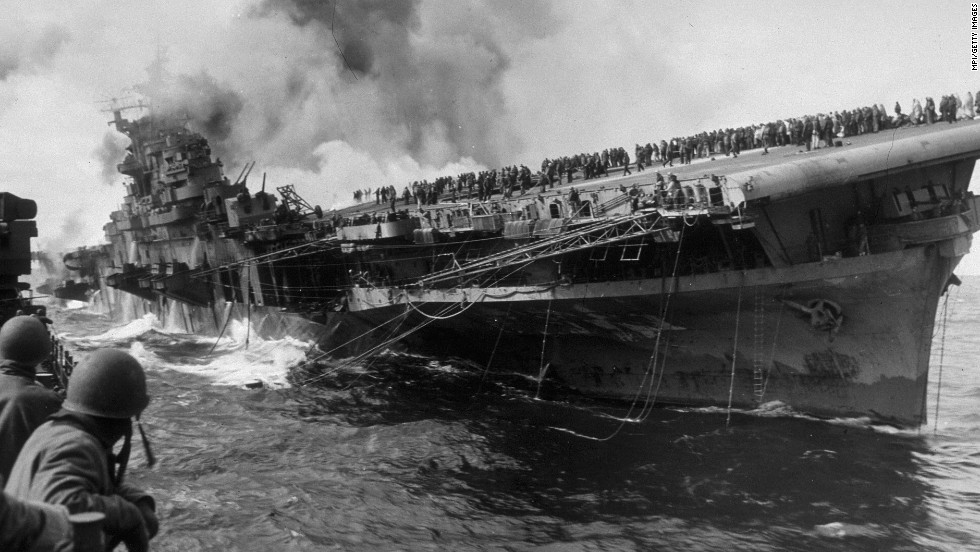 The Essex-class USS Franklin burns after being hit by a Japanese dive bomber in 1945. The ship was named after Benjamin Franklin and nicknamed &quot;Big Ben.&quot;