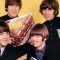 beatles holding albums