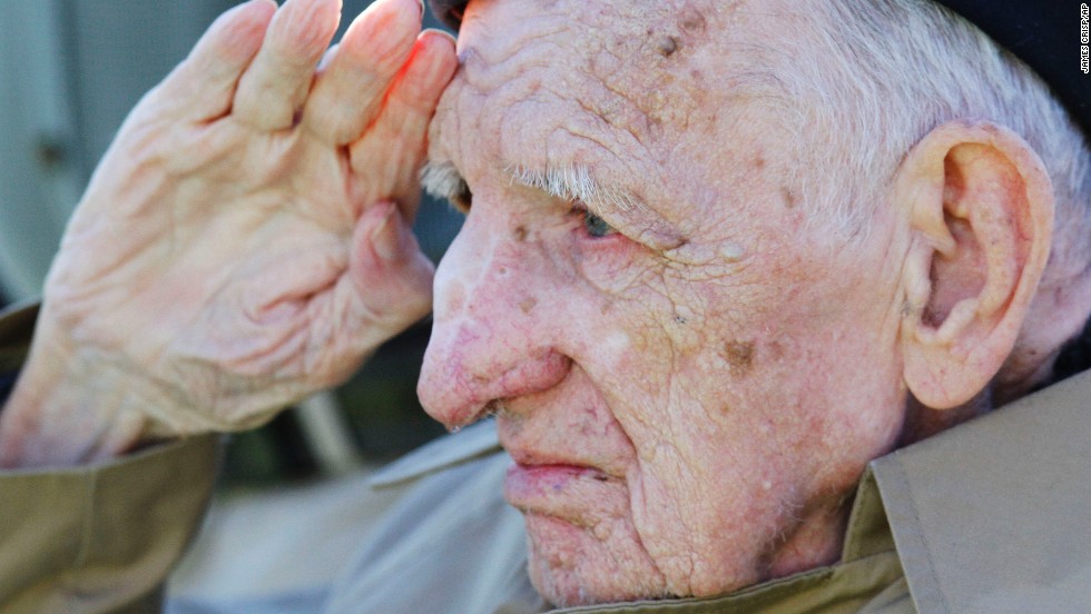 Jesse Beazley, a World War II veteran and D-Day survivor, salutes during the national anthem before a college football game between Kentucky and Missouri in Lexington, Kentucky, on Saturday, November 9. &lt;br /&gt;&lt;a href=&quot;http://www.cnn.com/2013/11/08/showbiz/gallery/celebrity-vets/index.html&quot;&gt;Photos: Celebrities who served&lt;/a&gt;&lt;br /&gt;&lt;a href=&quot;http://cnnphotos.blogs.cnn.com/2013/11/08/every-bit-a-woman-every-bit-a-veteran/&quot;&gt;Photos: Female veterans&lt;/a&gt;