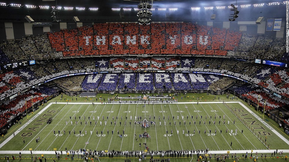 Veterans are honored before the start of Sunday&#39;s NFL football game between the New Orleans Saints and the Dallas Cowboys at the Superdome in New Orleans.