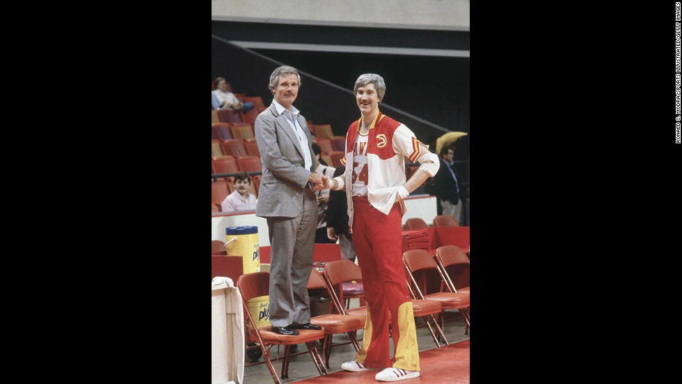 Turner stands next to Atlanta Hawks star Tom McMillen before an NBA game at the Omni Coliseum in Atlanta in March 1982. Turner bought the Hawks in the same year he won the America&#39;s Cup. It became his second professional sports team; in 1976, he had purchased the Atlanta Braves baseball team.