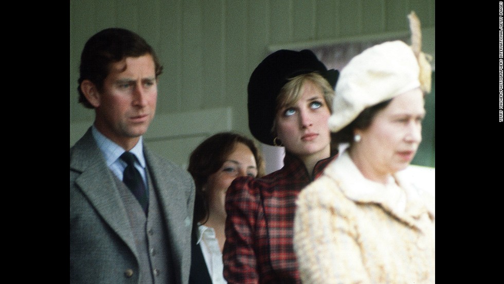 The prince and Princess Diana are seen behind the Queen during the Braemar Highland Games in Scotland in September 1981. 