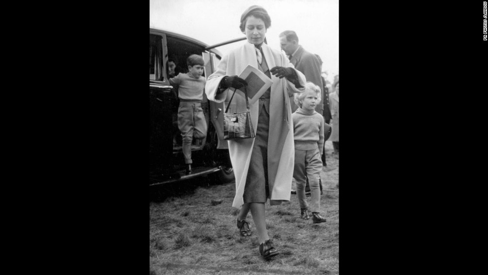 The Queen with Charles and his sister, Princess Anne, arrive at Windsor Great Park to watch events in the European Horse Trial in 1955. 