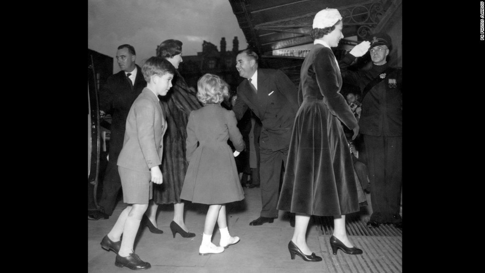 Prince Charles and Princess Anne follow their mother and Princess Margaret in London in 1956.  