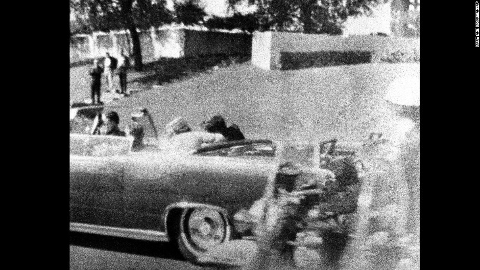 Kennedy slumps against his wife as the bullet strikes him in the head. Connally, who is wounded in the attack, begins to turn around just to the left of Jackie Kennedy. 