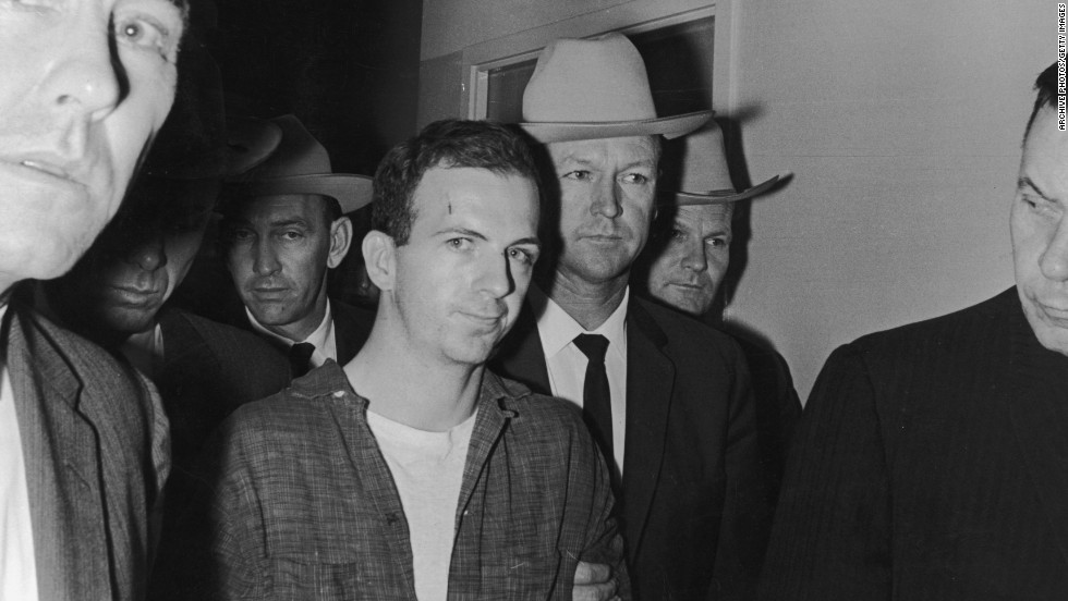 Lee Harvey Oswald, a 24-year-old ex-Marine, is arrested in the back of a movie theater where he fled after shooting Dallas Police Patrolman J.D. Tippit. That incident occurred approximately 45 minutes after the assassination. 