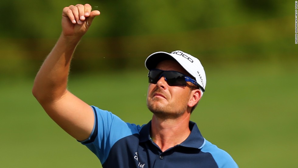 Henrik Stenson checks the wind during his opening round of four-under. He is the favorite to claim the Race to Dubai crown after a stellar season, which also saw him take the PGA Tour&#39;s FedEx Cup. If he were to win the European Tour&#39;s season finale he&#39;d be the first golfer ever to do the double.