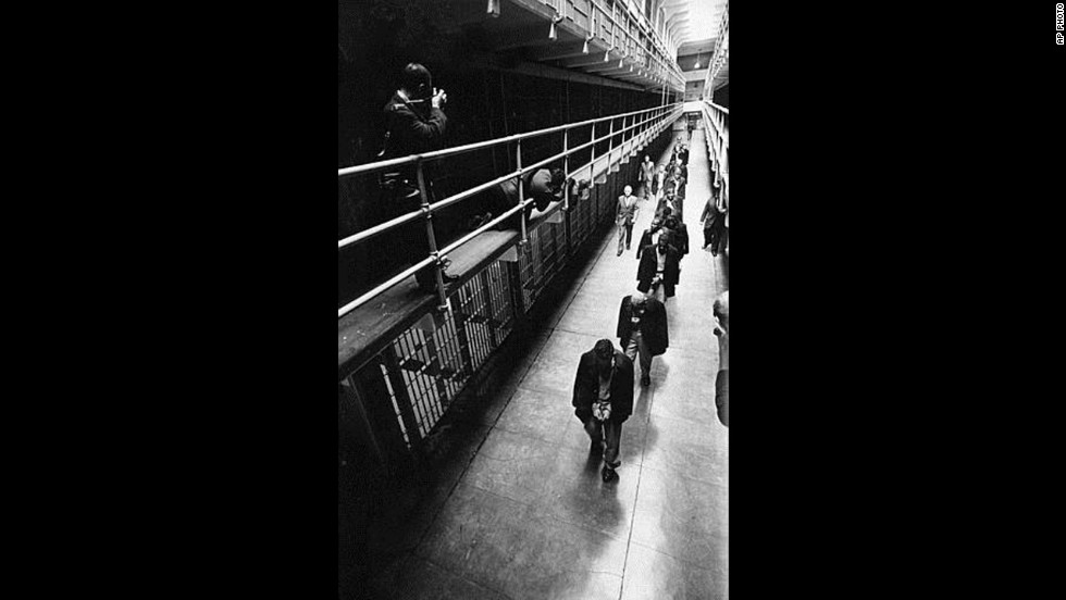 A line of handcuffed prisoners, the last convicts held at Alcatraz prison, walk through a cell block as they are transferred to other prisons from Alcatraz Island on San Francisco Bay, California, on March 21, 1963. Alcatraz, known as &quot;The Rock,&quot; was a federal penitentiary for 29 years and a prison for more than a century. 