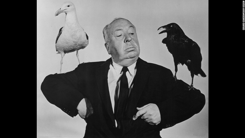 British film director Alfred Hitchcock poses with a seagull and a raven in a promotional still for his film &quot;The Birds.&quot; The film was released on March 28, 1963.