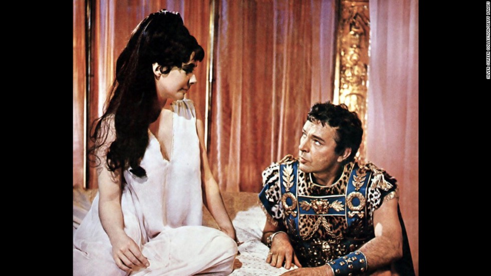 Elizabeth Taylor and Richard Burton appear in a publicity still for the film &quot;Cleopatra,&quot; which premiered on June 12, 1963. The historical drama, directed by Joseph L. Mankiewicz, starred Taylor as Cleopatra, and Burton as Mark Antony. 