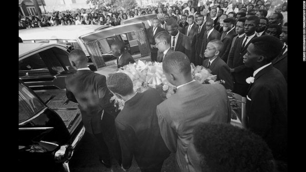 A coffin is loaded into a hearse at a funeral in Birmingham, Alabama, for victims of &lt;a href=&quot;http://www.cnn.com/2013/09/14/us/birmingham-church-bombing-anniversary-victims-siblings/&quot;&gt;the 16th Street Baptist Church bombing&lt;/a&gt;. Four African-American girls were killed and at least 14 others were wounded when a bomb blast tore through church services on September 15, 1963. Three former Ku Klux Klan members were later convicted of murder for the bombing.
