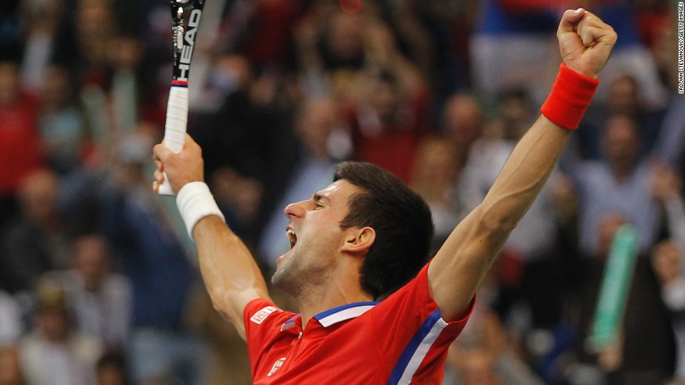 Novak Djokovic celebrates his straight sets victory over Tomas Berdych to draw Serbia level with the Czech Republic in the Davis Cup final.at 2-2.  