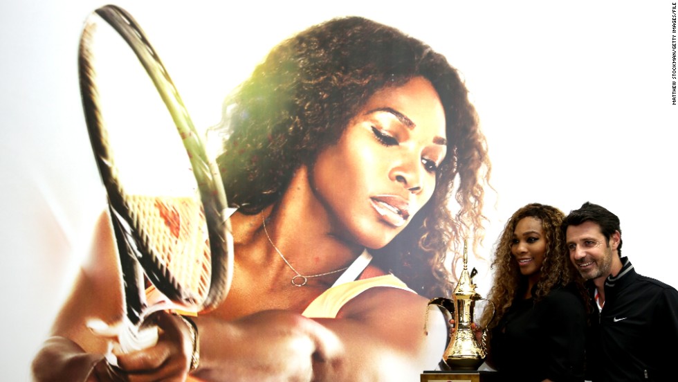 Serena Williams poses with her coach Patrick Mouratoglou after reclaiming the year-end world No. 1 ranking she last held in 2009. 