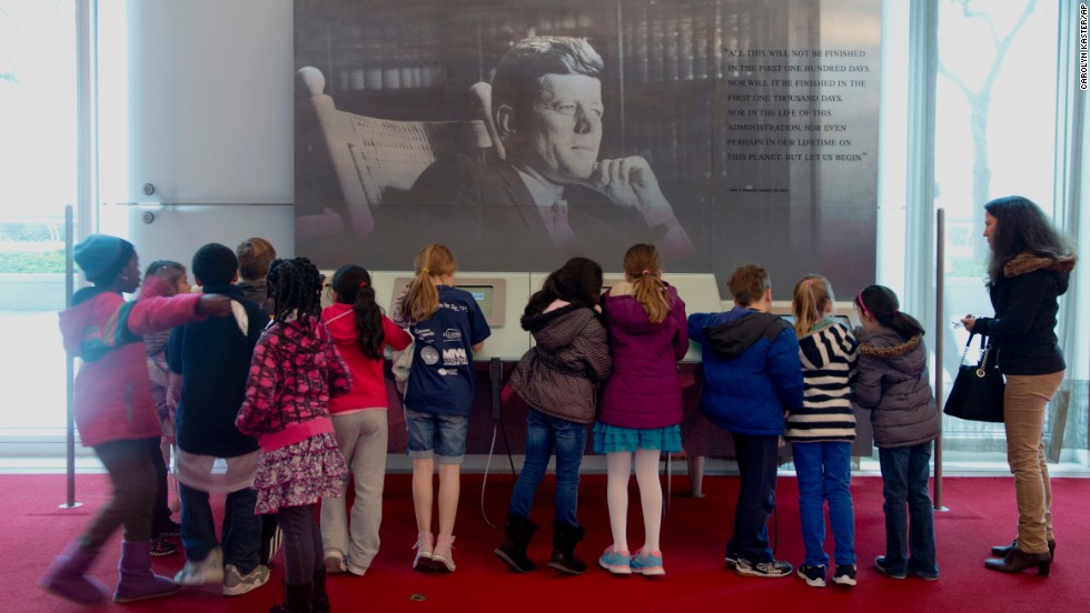 On the 50th anniversary of John F. Kennedy&#39;s death, children gather around a multimedia display Friday, November 22, in the grand foyer of the John F. Kennedy Center for the Performing Arts in Washington.