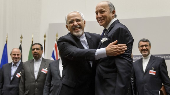Iranian Foreign Minister Mohammad Javad Zarif, left, and French Foreign Minister Laurent Fabius react after the announcement. 