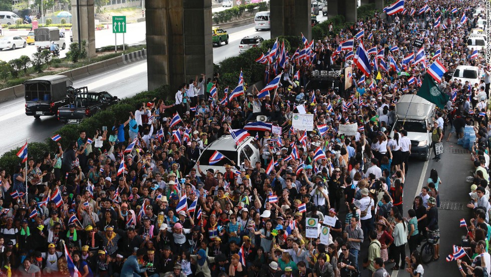 Flag-waving protesters vowing to topple the Thai prime minister took to the streets of Bangkok for a fourth day Wednesday, declaring they would take over &quot;every ministry&quot; of the government.