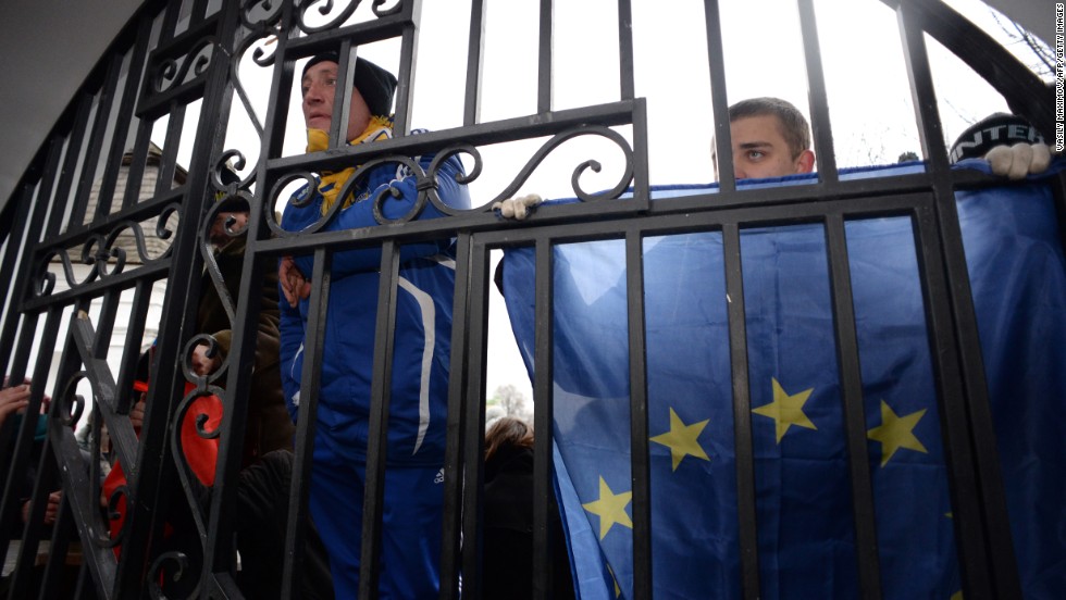 Opposition supporters hold EU flags November 30 as they guard the gates of the Mikhailovsky monastery.