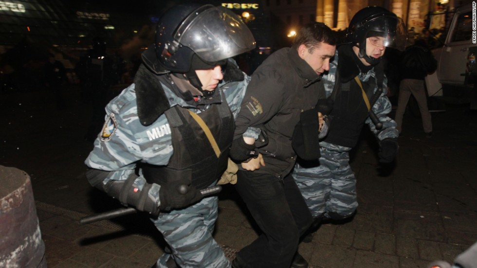 Ukrainian riot police detain a protester on November 30.