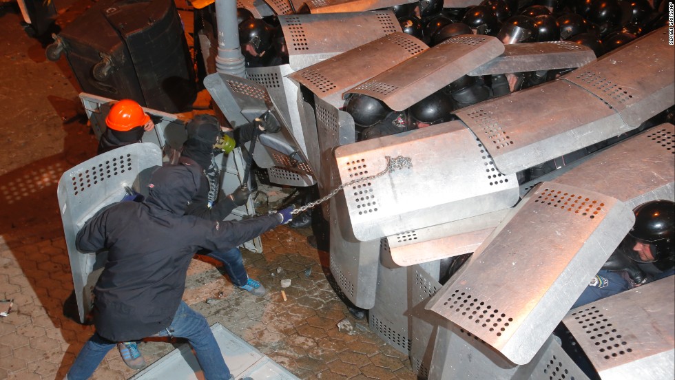 Protesters clash with police guarding the presidential administration building on December 1.