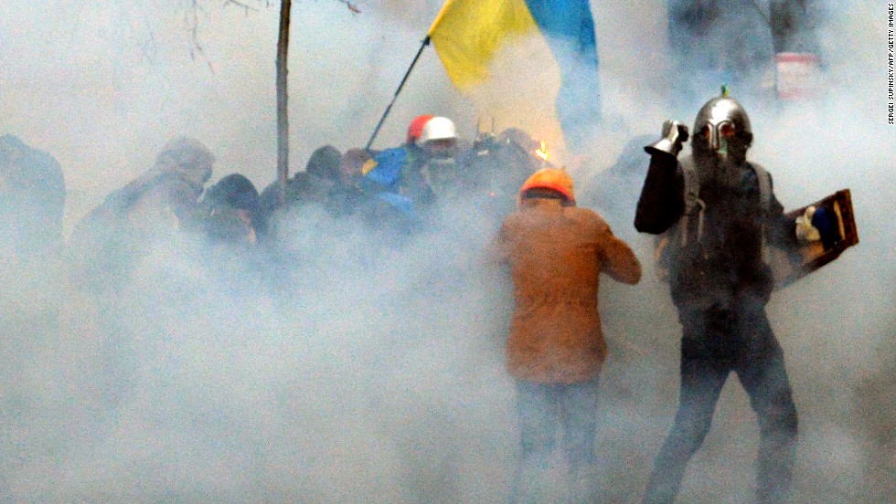 Pro-EU demonstrators clash with police near the presidential administration office on December 1.