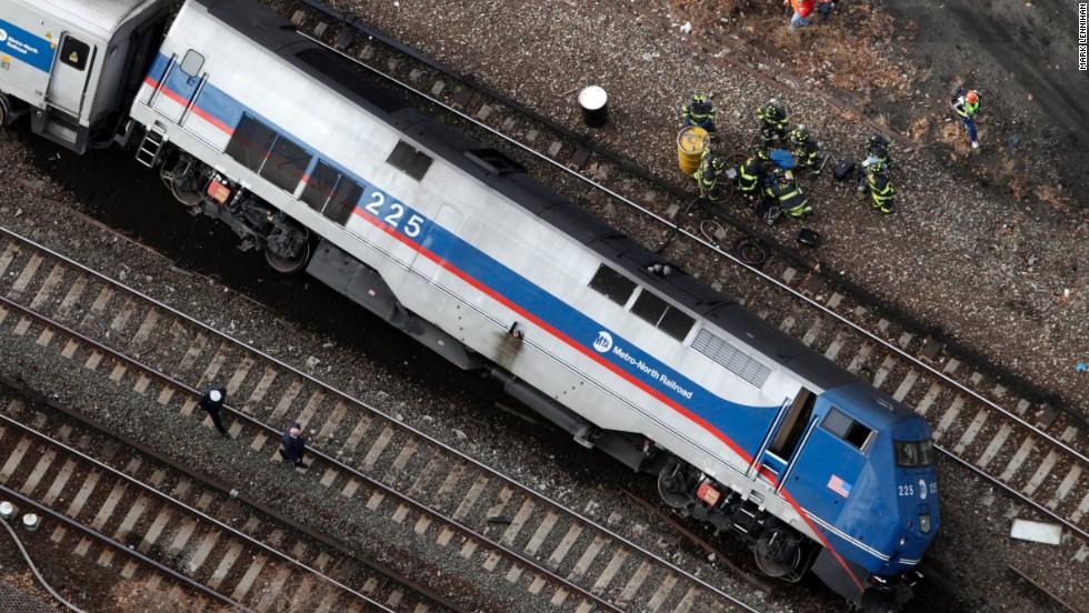 A train car lies on its side after derailing December 1.