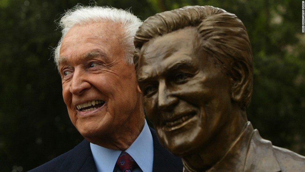 Barker poses next to a sculpture of himself as he was inducted into the Television Academy Hall of Fame in 2004.