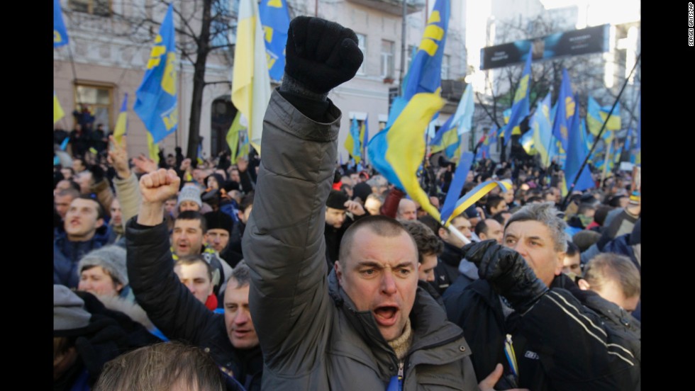 Protesters chant slogans outside the parliament in Kiev on December 3.