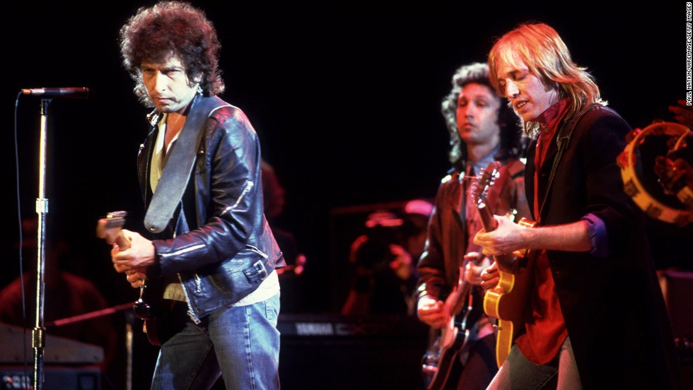 Dylan performs with Tom Petty at Farm Aid in Chicago in 1985.